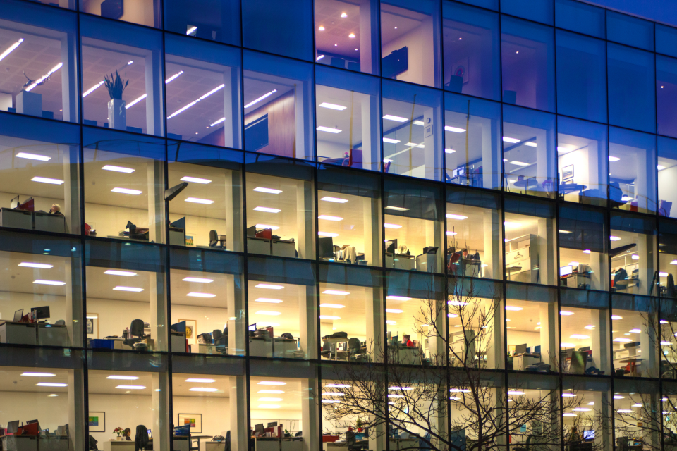 Offices at night with lights on